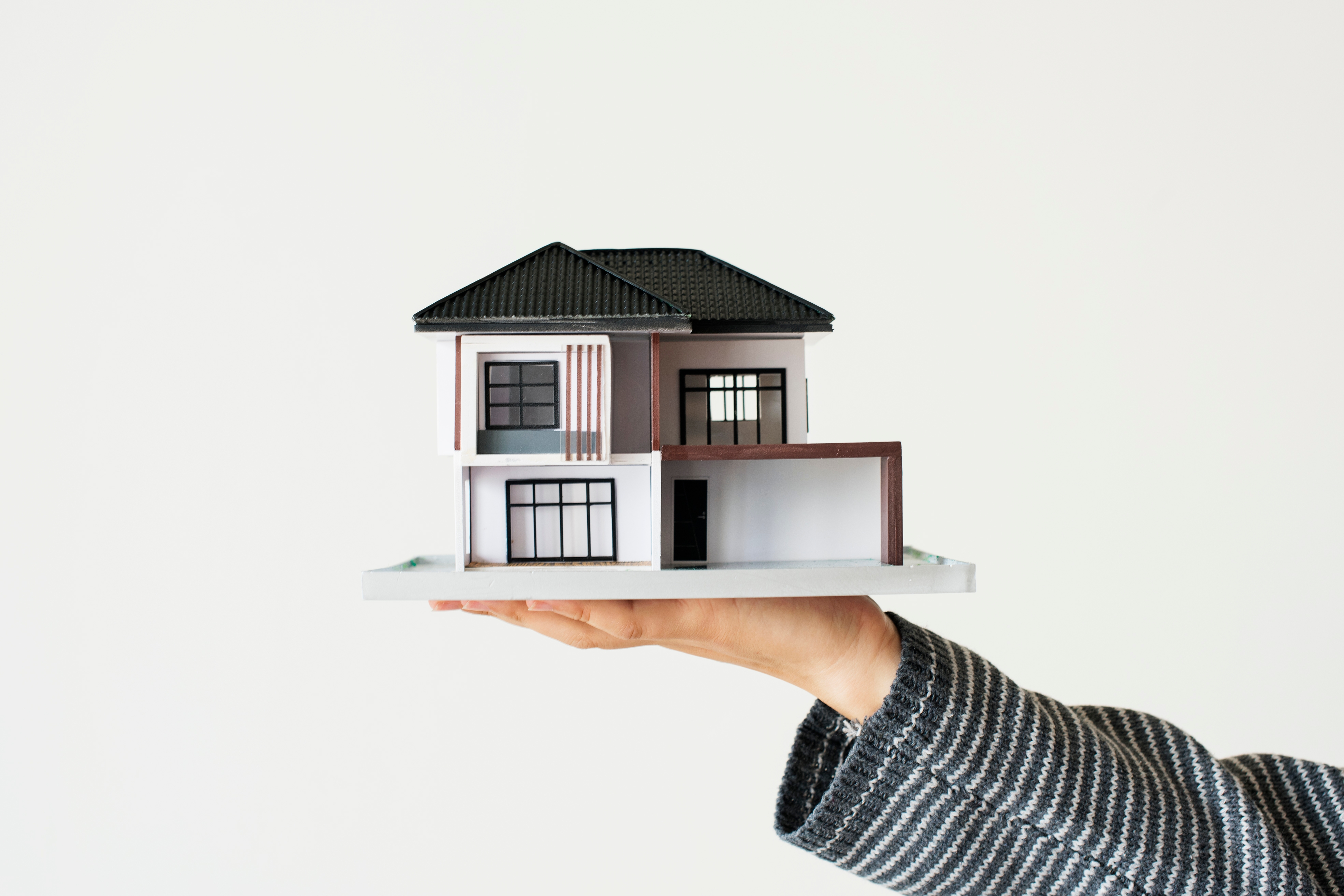 Hand Presenting Model House Home Loan Campaign